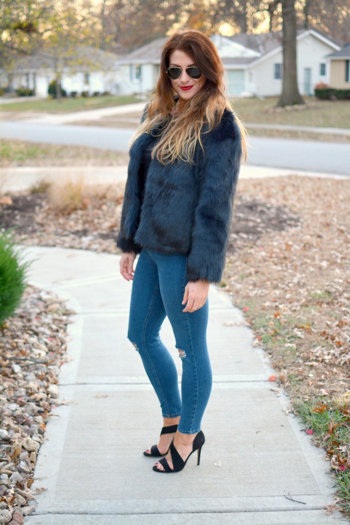 Ashley from LSR in a navy faux fur coat and heels from H&M.