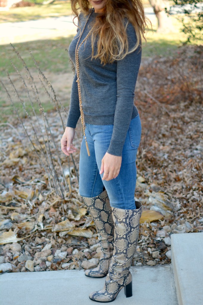 Ashley from LSR in a gray sweater and Sam Edelman Rylan boots