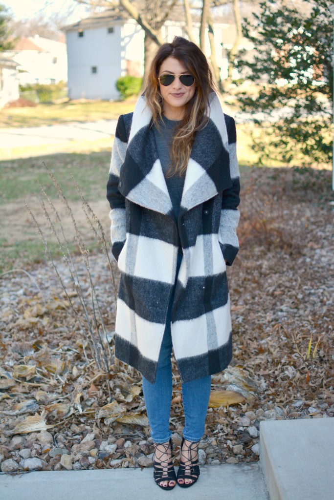 Ashley from LSR in a plaid statement coat, Gap jeans, and black lace-up sandals