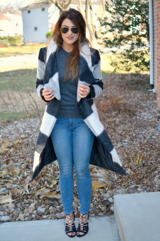 Ashley from LSR in a plaid statement coat, Gap jeans, and black lace-up sandals