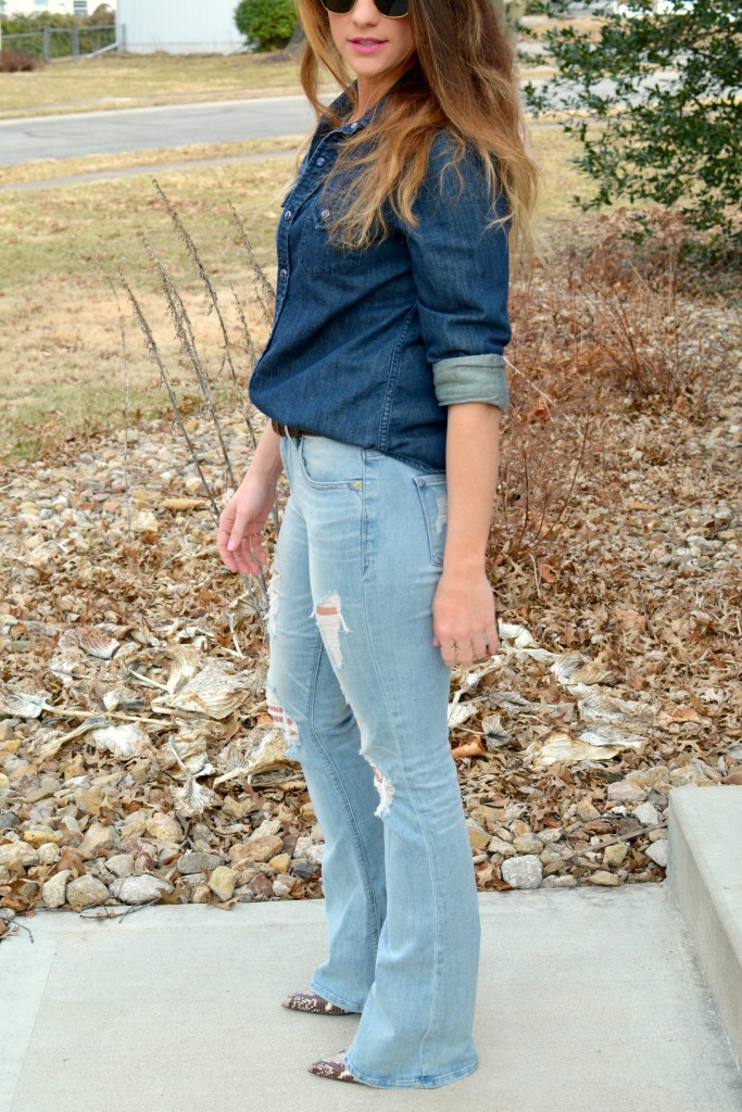 Ashley from LSR in Ray-Ban Clubmaster sunglasses, flare jeans, and a denim shirt