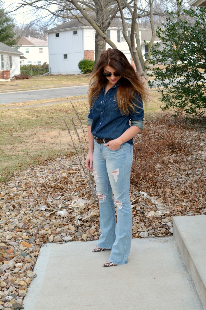 Ashley from LSR in Ray-Ban Clubmaster sunglasses, flare jeans, and a denim shirt