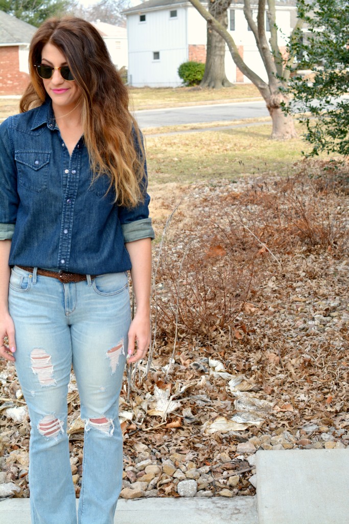 Ashley from LSR in Ray-Ban Clubmaster sunglasses, flare jeans, and a denim shirt