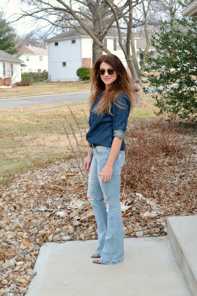 Ashley from LSR in Ray-Ban Clubmaster sunglasses, flare jeans, and a denim shirt