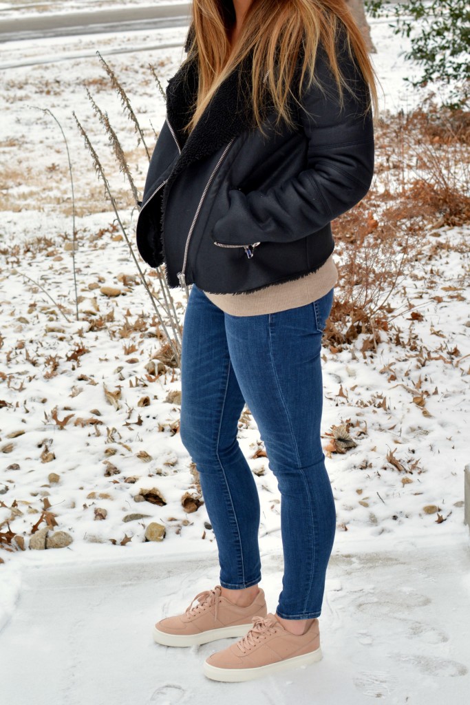 Ashley from LSR in rose quartz sneakers and a shearling moto jacket