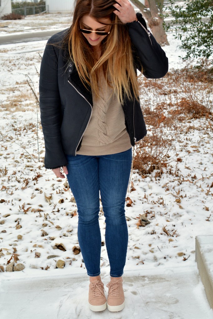 Ashley from LSR in rose quartz sneakers and a shearling moto jacket