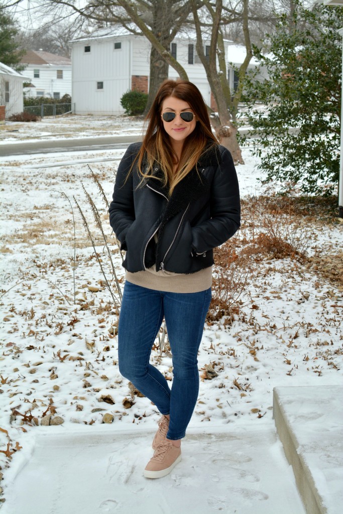 Ashley from LSR in rose quartz sneakers and a shearling moto jacket