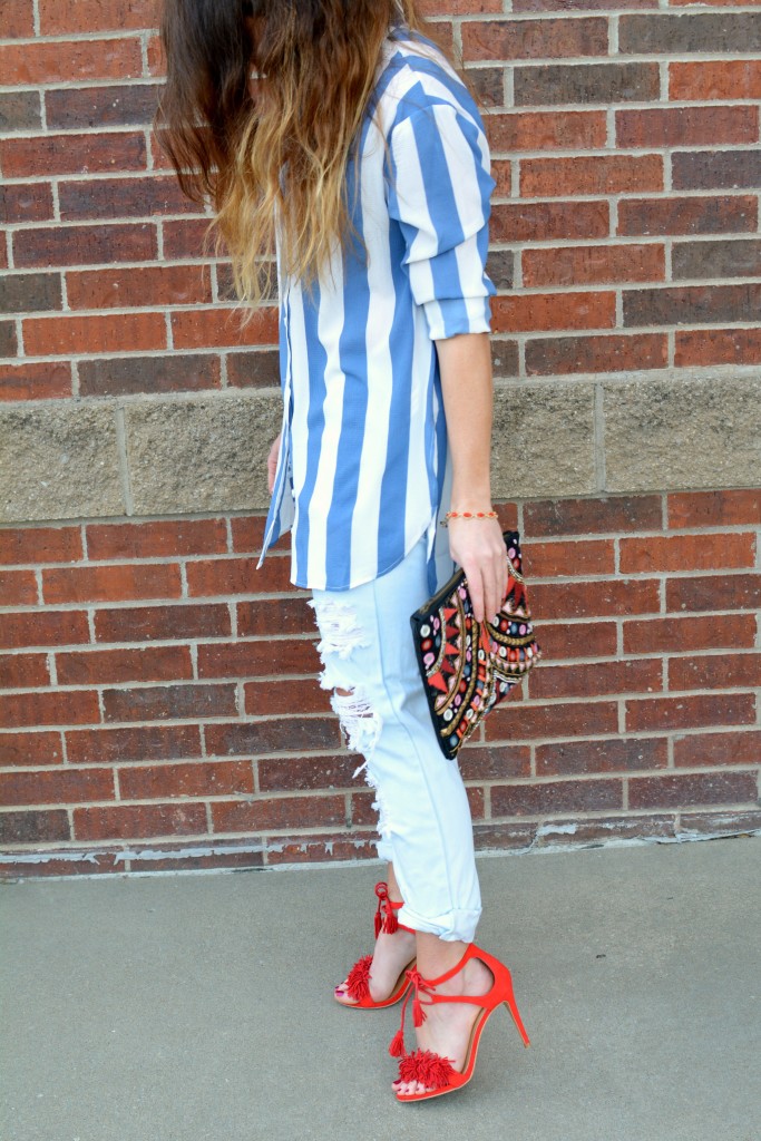 Ashley from LSR in a Boohoo striped shirt and One Teaspoon jeans, with red fringe sandals.