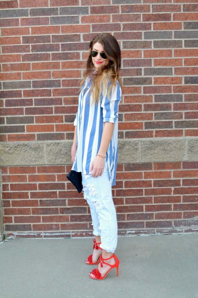 Ashley from LSR in a Boohoo striped shirt and One Teaspoon jeans, with red fringe sandals.