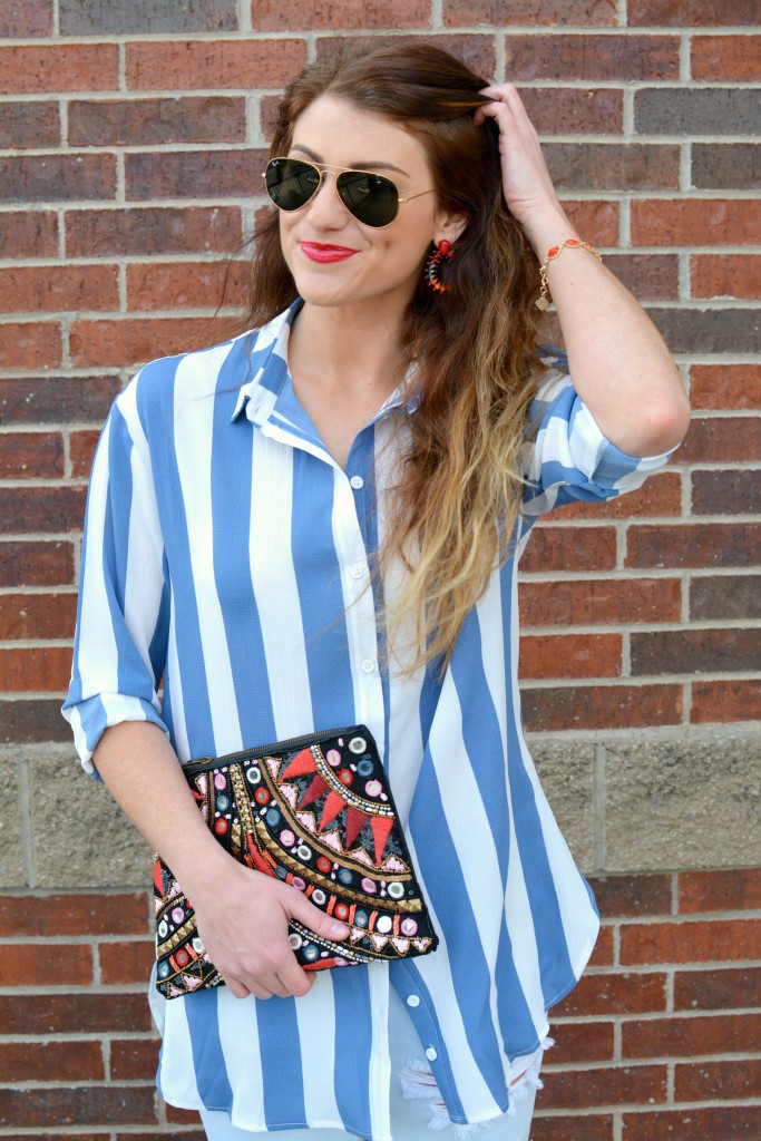 Ashley from LSR in a Boohoo striped shirt and clutch