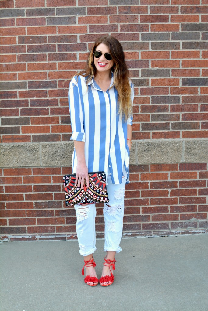 Ashley from LSR in a Boohoo striped shirt and One Teaspoon jeans, with red fringe sandals.