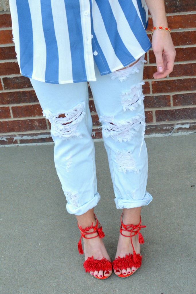 Ashley from LSR in a Boohoo striped shirt and One Teaspoon jeans, with red fringe sandals.