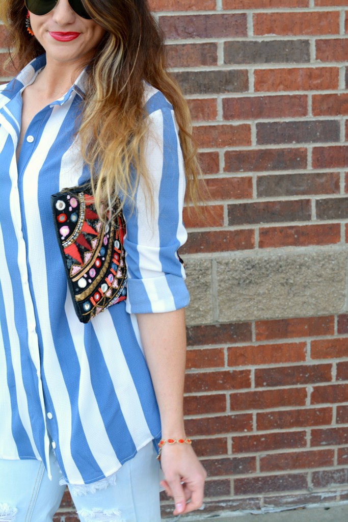 Ashley from LSR in a Boohoo striped shirt and clutch