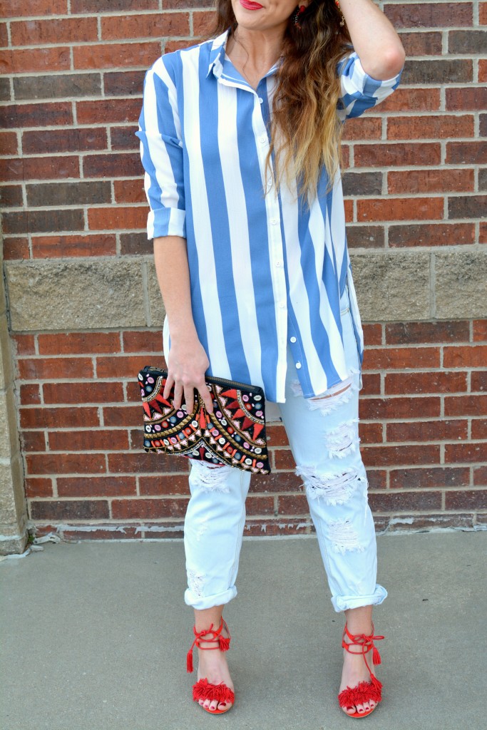 Ashley from LSR in a Boohoo striped shirt and One Teaspoon jeans, with red fringe sandals.