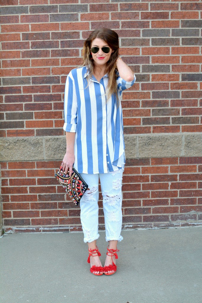 Ashley from LSR in a Boohoo striped shirt and One Teaspoon jeans, with red fringe sandals.