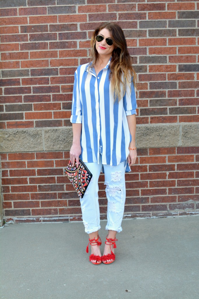 Ashley from LSR in a Boohoo striped shirt and One Teaspoon jeans, with red fringe sandals.