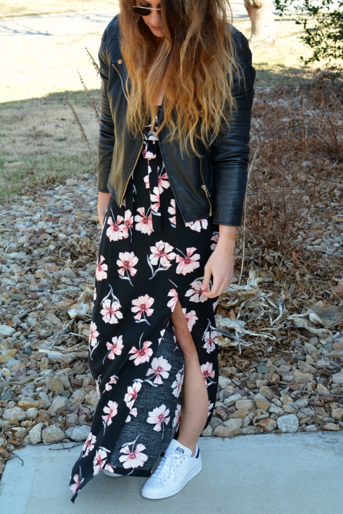 Ashley from LSR in a floral maxi dress, leather jacket, and Stan Smith sneakers