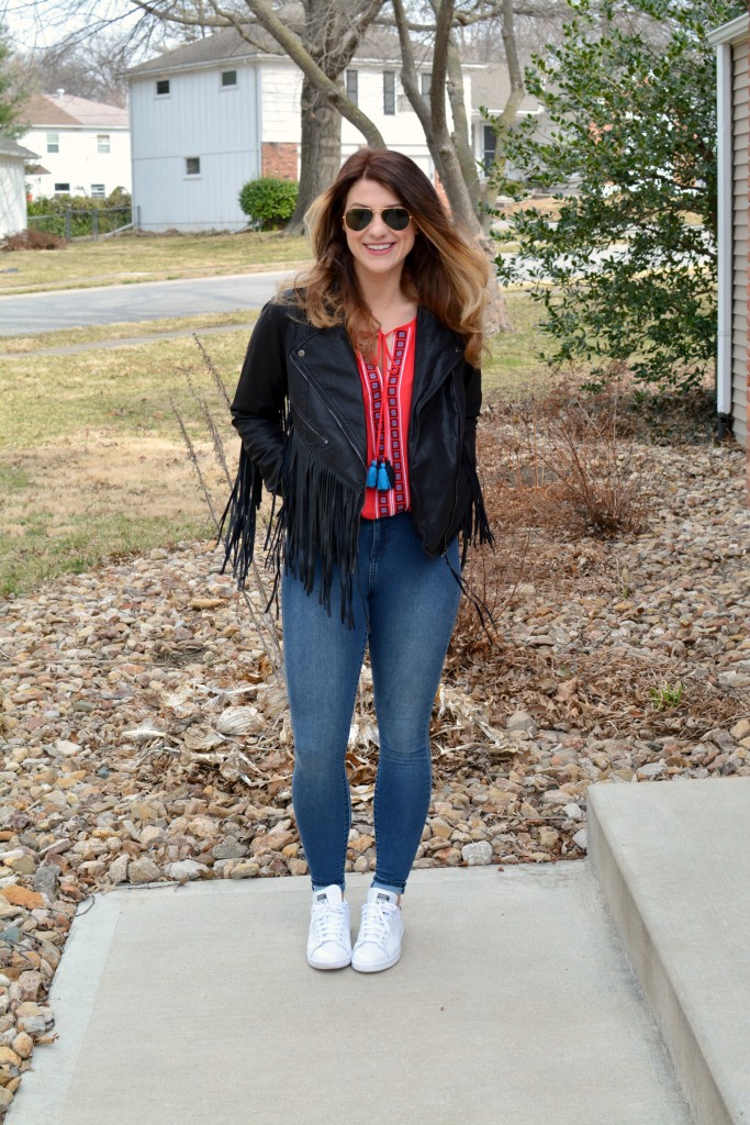 Ashley from LSR in a fringe faux leather jacket, peasant blouse, and Stan Smith sneakers