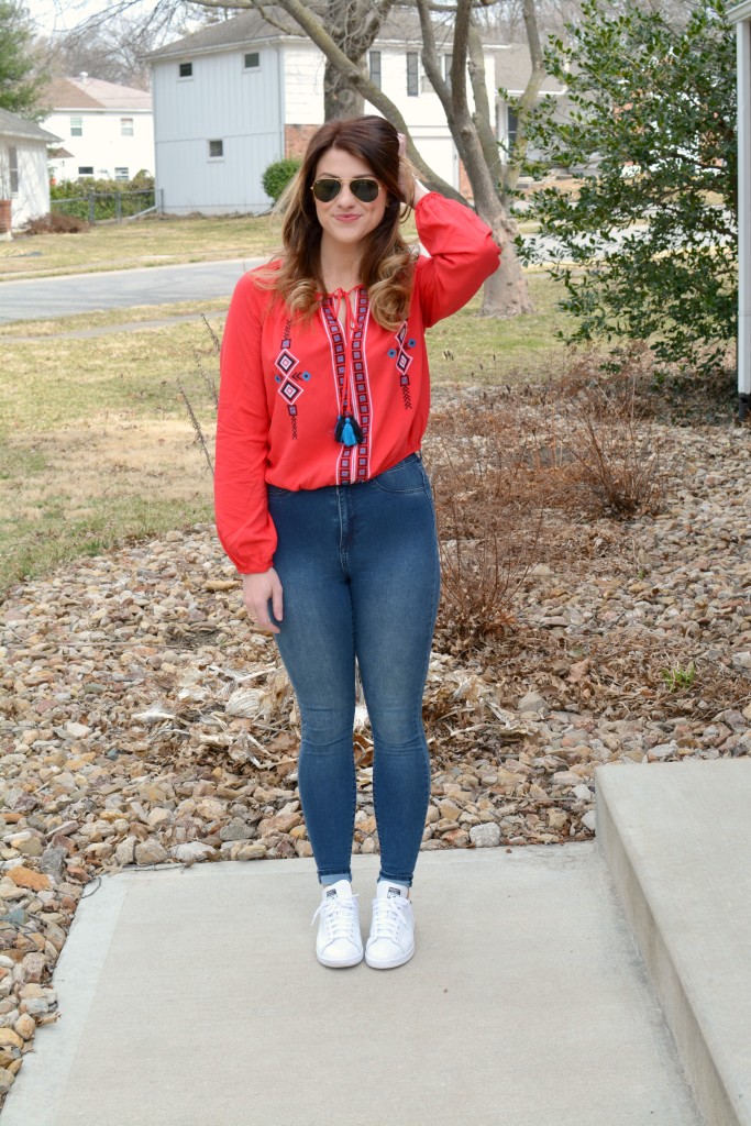 Ashley from LSR in a red peasant blouse and Stan Smith sneakers