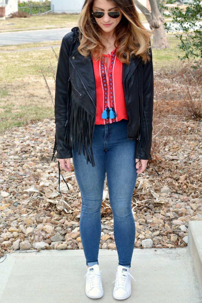 Ashley from LSR in a fringe faux leather jacket, peasant blouse, and Stan Smith sneakers
