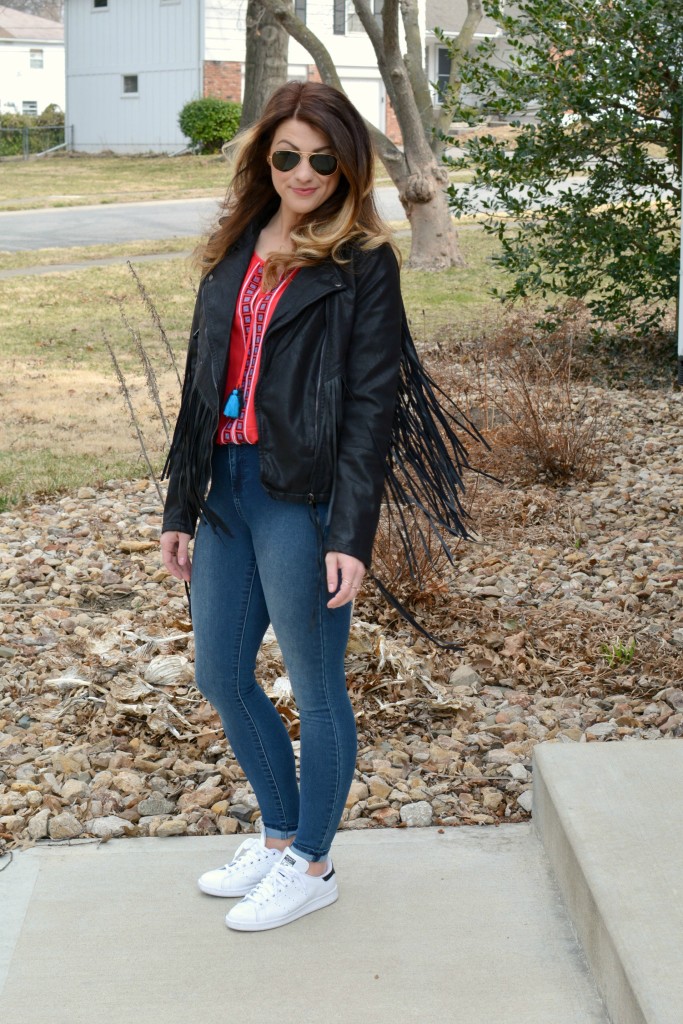 Ashley from LSR in a fringe faux leather jacket, peasant blouse, and Stan Smith sneakers