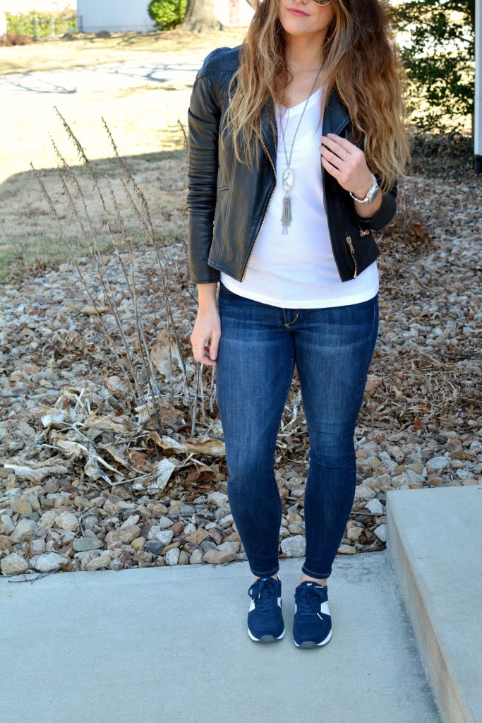Ashley from LSR in a leather biker jacket and Michael Michael Kors Allie sneakers