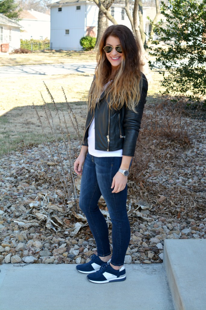 Ashley from LSR in a leather biker jacket and Michael Michael Kors Allie sneakers