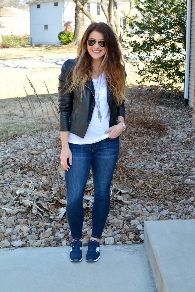 Ashley from LSR in a leather biker jacket and Michael Michael Kors Allie sneakers