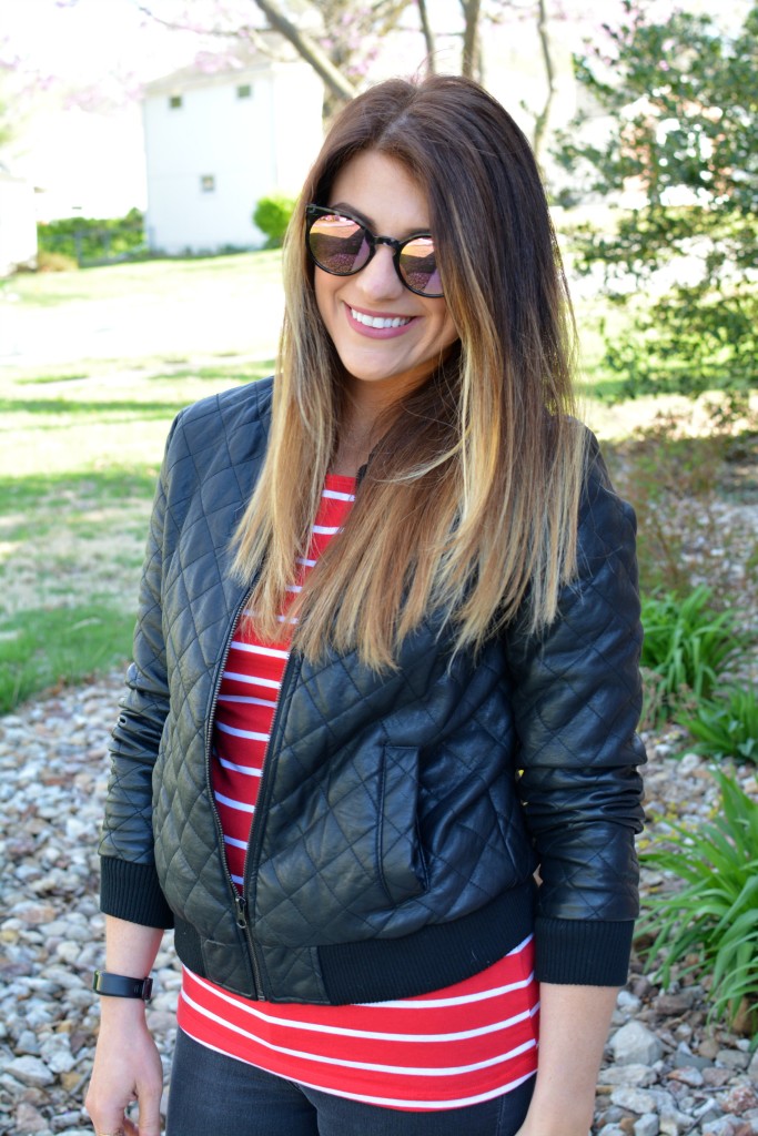 Ashley from LSR in a quilted leather jacket and a red stripe t-shirt