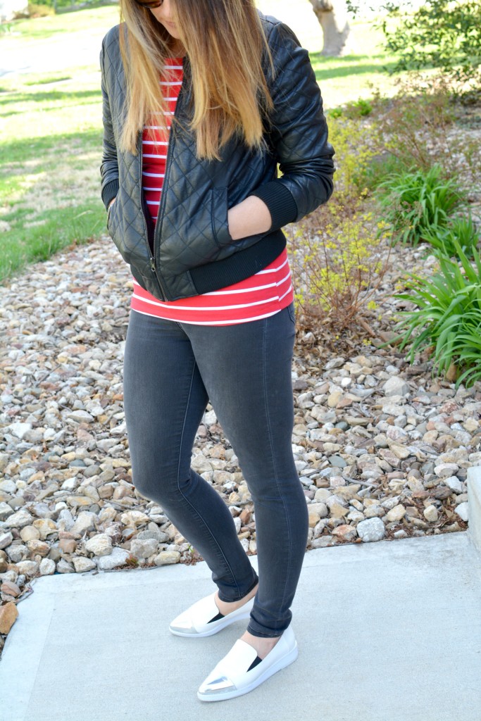 Ashley from LSR in a quilted leather jacket and a red stripe t-shirt