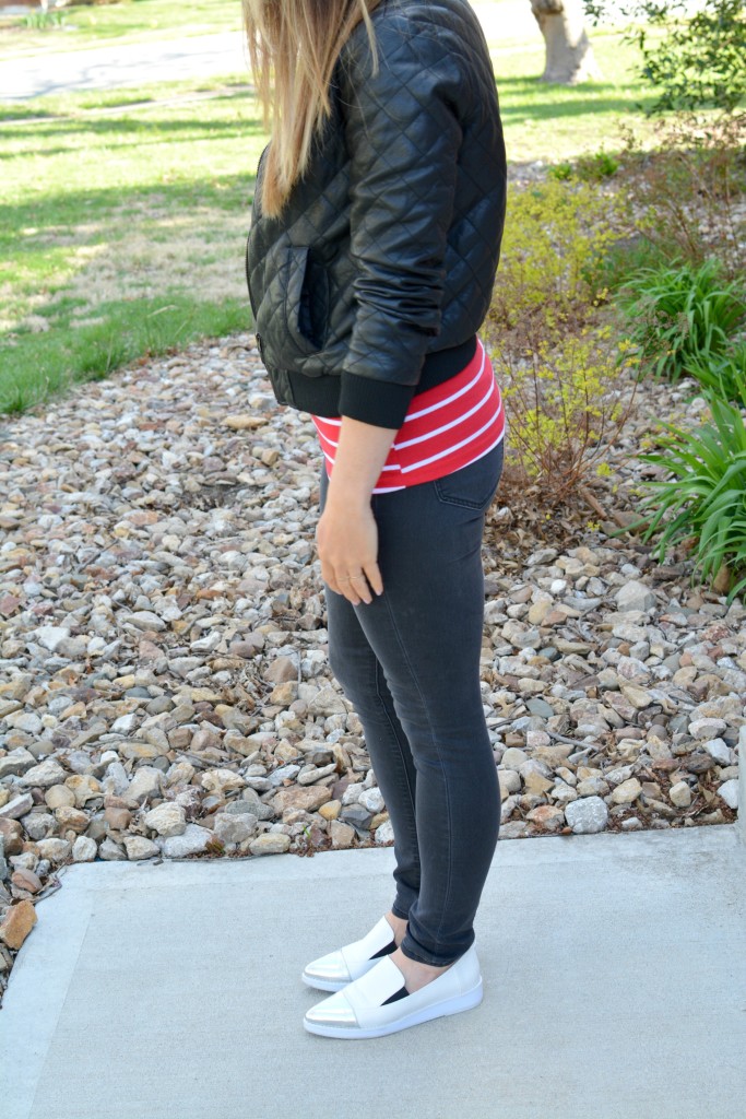 Ashley from LSR in a quilted leather jacket and a red stripe t-shirt