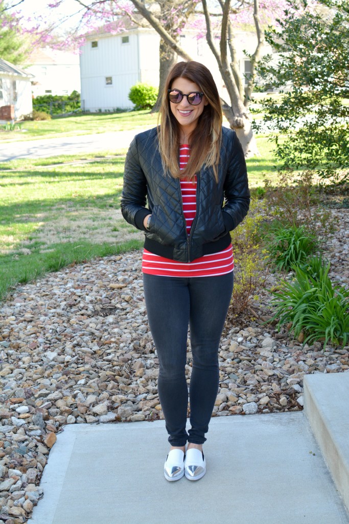 Ashley from LSR in a quilted leather jacket and a red stripe t-shirt