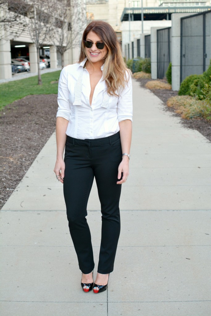 Ashley from LSR in a white shirt and black trousers with a bow tie and Christian Louboutin pumps for KCFW