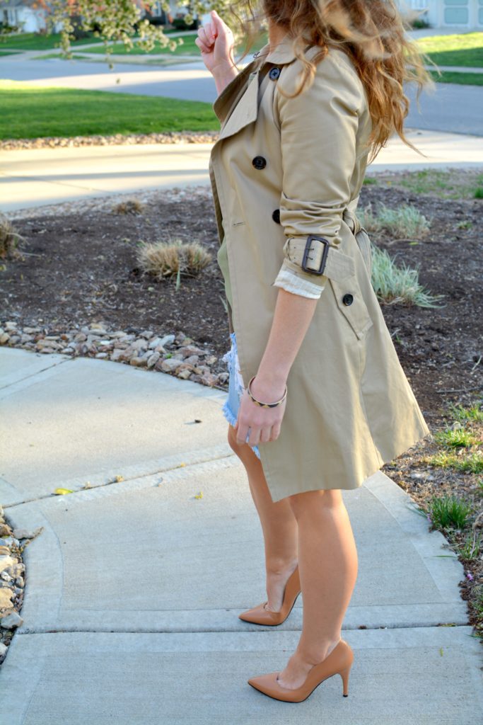 Ashley from LSR in a classic trench coat and a destroyed denim pencil skirt