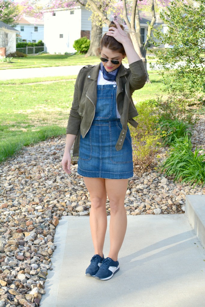 Ashley from LSR in an overall dress, suede jacket, retro sneakers, and a bandanna