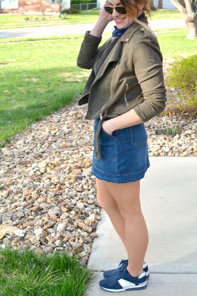 Ashley from LSR in an overall dress, suede jacket, retro sneakers, and a bandanna