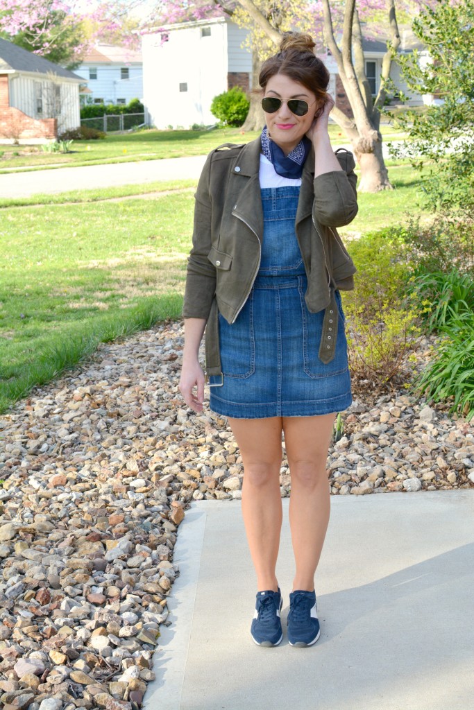 Ashley from LSR in an overall dress, suede jacket, retro sneakers, and a bandanna