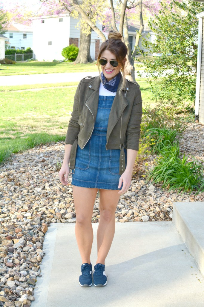 Ashley from LSR in an overall dress, suede jacket, retro sneakers, and a bandanna