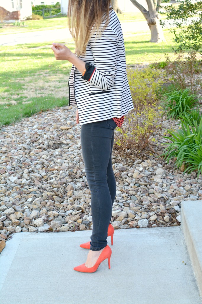 Ashley from LSR in a striped blazer, printed blouse, and bright pumps