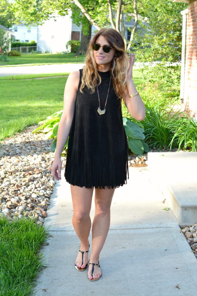 Ashley from LSR wearing a black suede fringe dress and black sandals