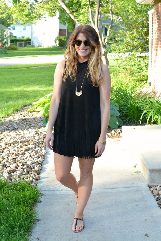 Ashley from LSR wearing a black suede fringe dress and black sandals