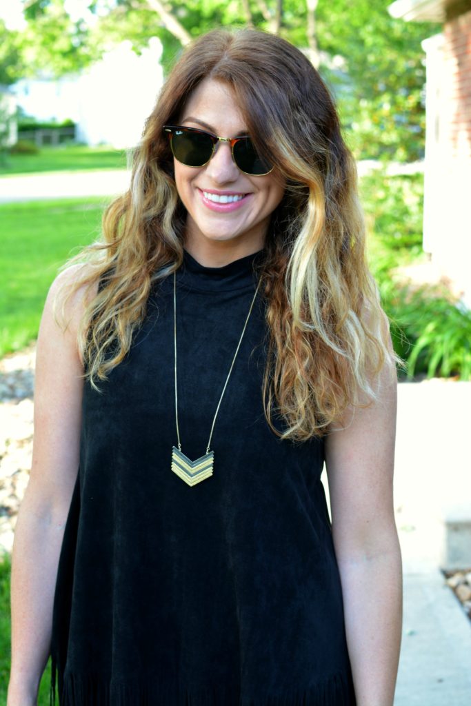 Ashley from LSR wearing a black suede fringe dress and a Madewell arrowstack necklace