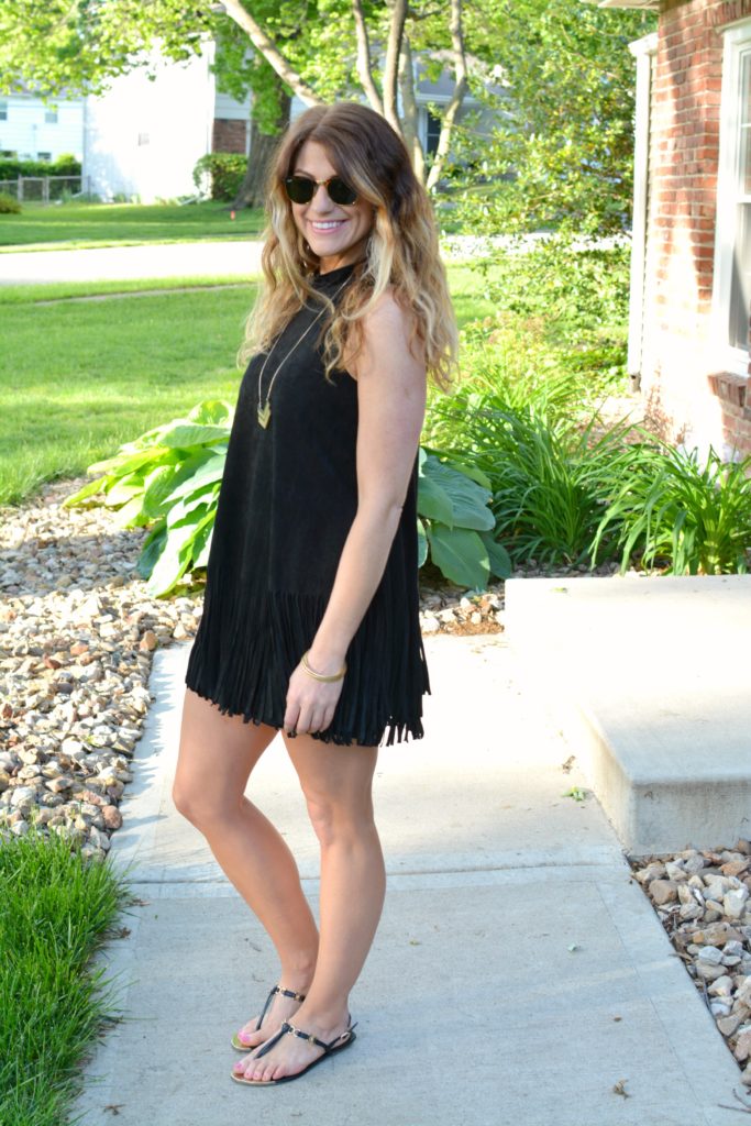 Ashley from LSR wearing a black suede fringe dress and black sandals