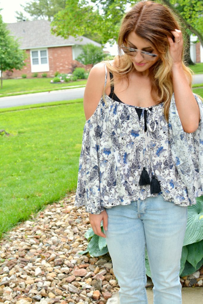 Ashley form LSR in a boho off-the-shoulder top and men's H&M jeans