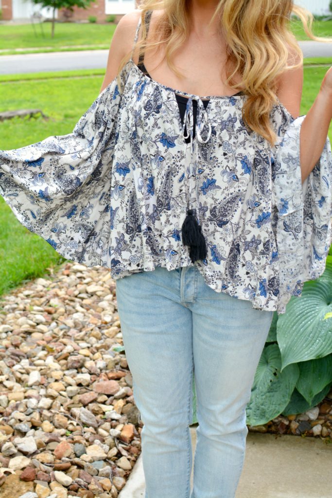 Ashley form LSR in a boho off-the-shoulder top and men's H&M jeans