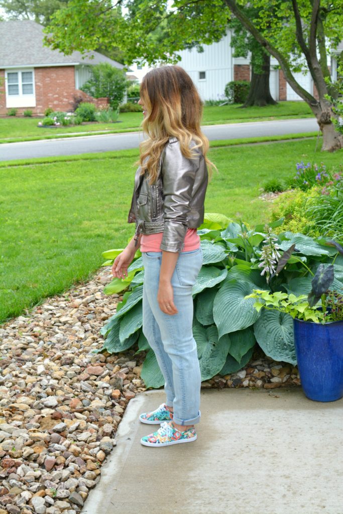 Ashley from LSR in a silver moto jacket, men's H&M denim, and floral sneakers