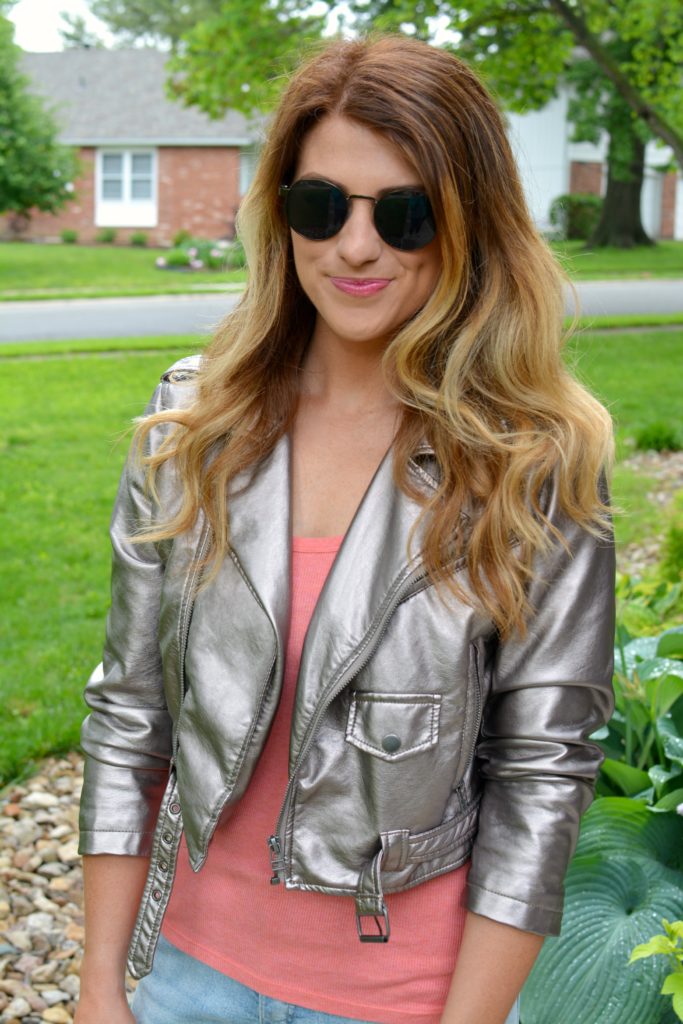 Ashley from LSR in a silver moto jacket and round sunglasses