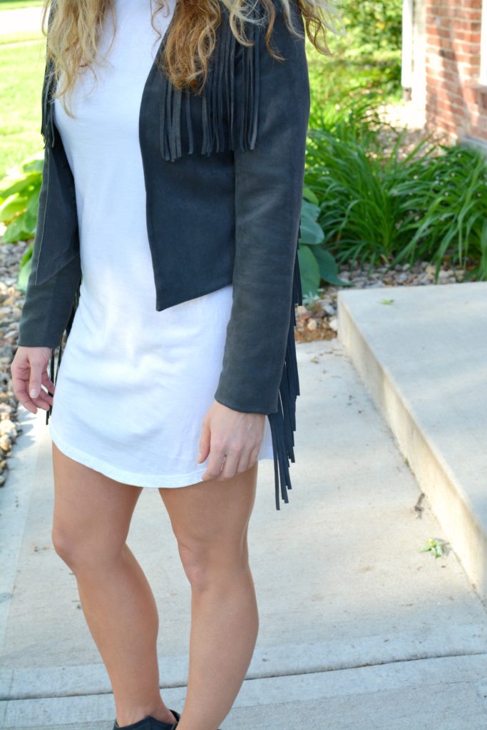Ashley from LSR in a t-shirt dress and fringe suede jacket