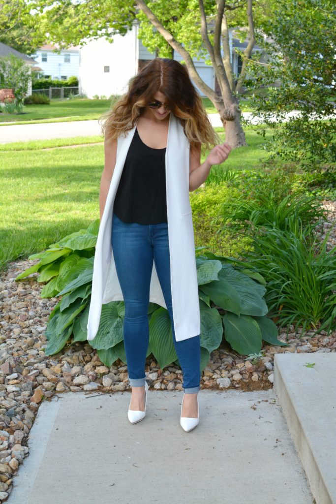 Ashley from LSR in a long white vest and white pumps