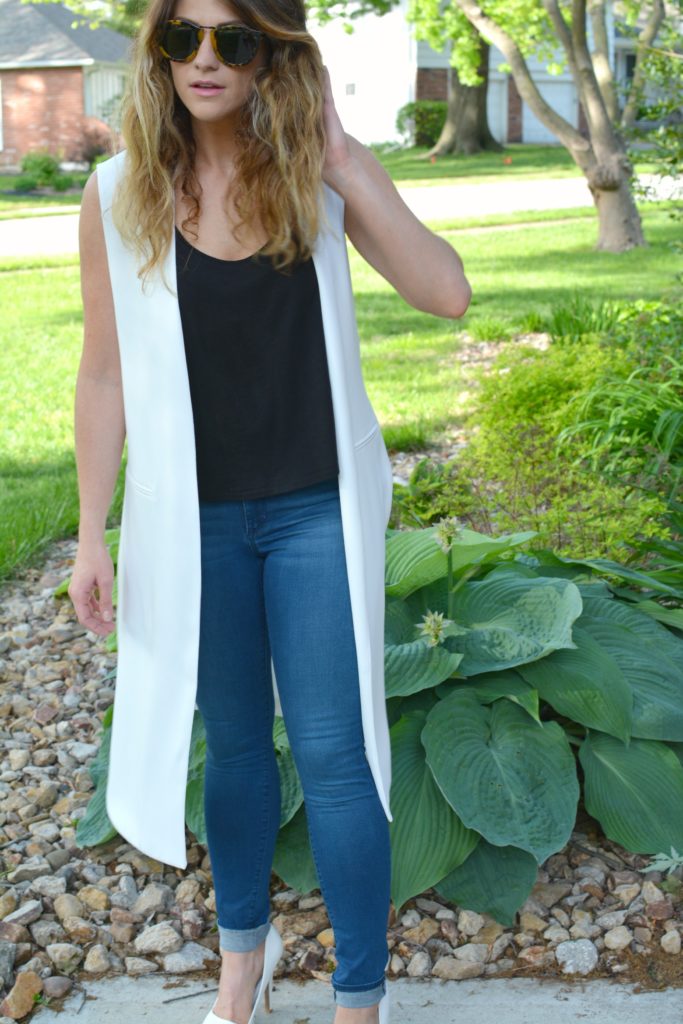 Ashley from LSR in a long white vest and white pumps